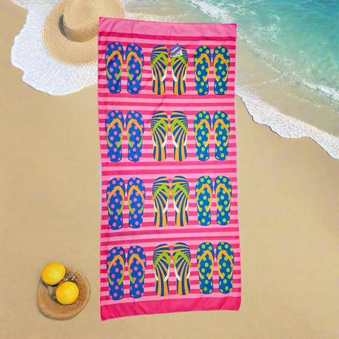 Beach towel with colorful flip-flop pattern on pink and white stripes
