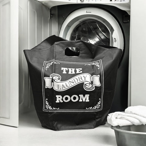 Black laundry bag with 'The Laundry Room' text in front of a washing machine.
