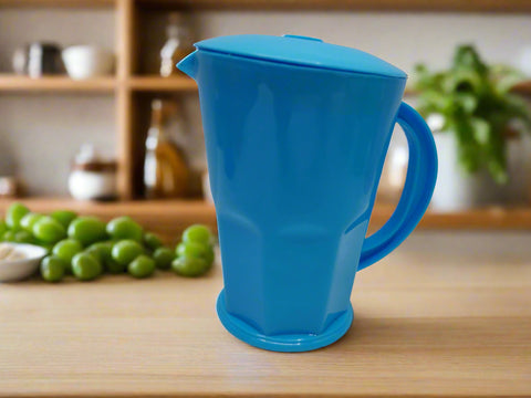 Blue plastic pitcher on a white background