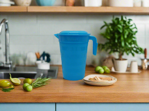 Blue plastic pitcher on a white background