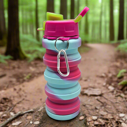 Collapsible water bottle with pink and blue gradient on a white background