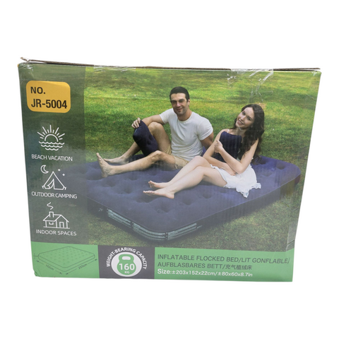 Inflatable air mattress packaging with a couple on a grassy field