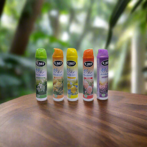A row of M7 air freshener spray bottles in various colors, each representing a different scent.
