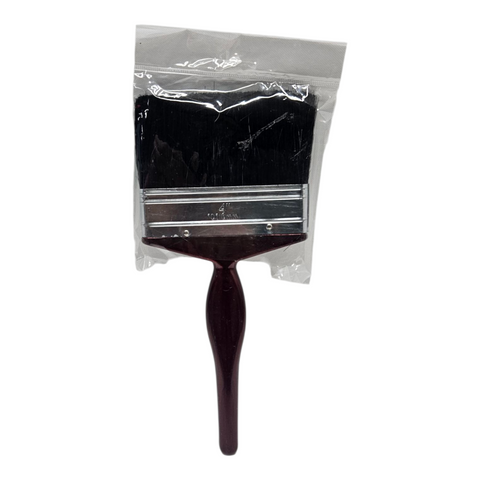 Paint brush with black bristles and wooden handle in clear packaging on a white background