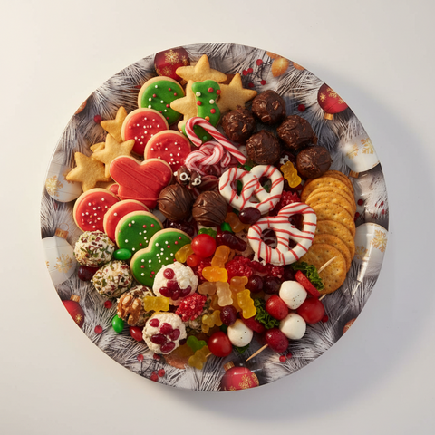 Round decorative plate with Christmas design and 'Merry Christmas' text.