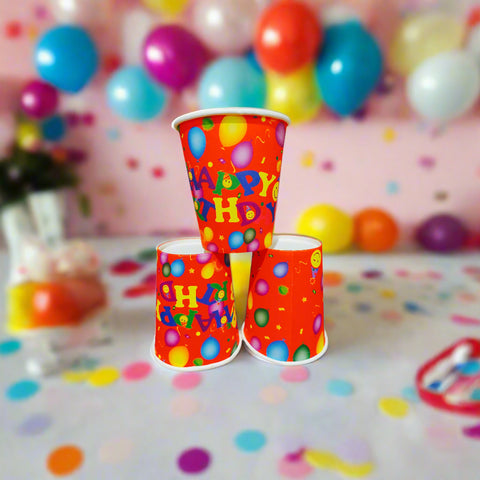 Three colorful paper cups with 'Happy Birthday' text on a white background