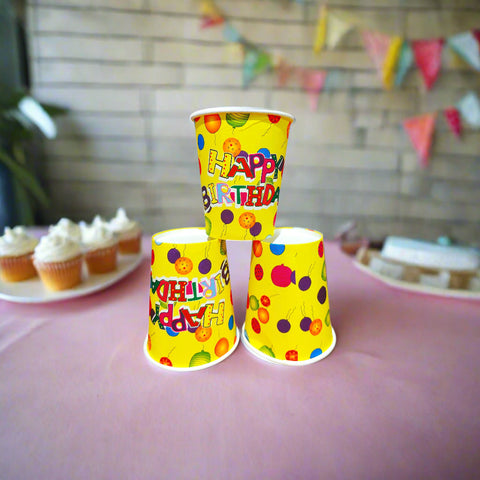 Three colorful paper cups with 'Happy Birthday' text on a white background