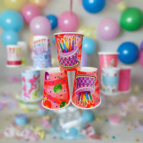 Three colorful party cups with festive designs on a white background