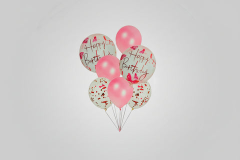Pink and white balloons with 'Happy Birthday' text on a white background