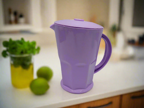 Purple pitcher on a white background