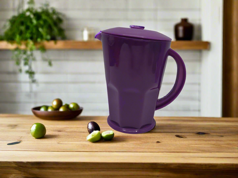 Purple pitcher on a white background