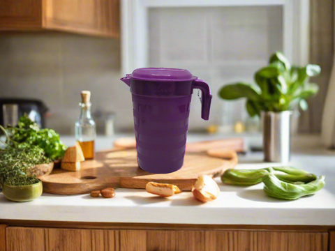 Purple plastic pitcher on a white background