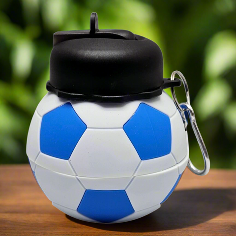 Soccer ball-shaped container with a black lid and carabiner on a white background