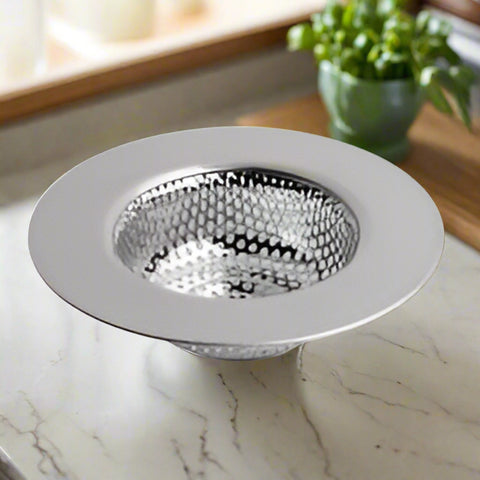Stainless steel kitchen sink drain strainer on a white background