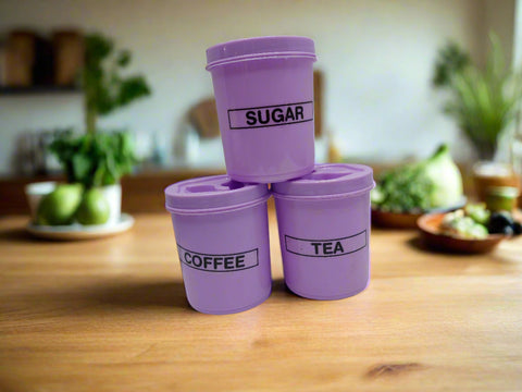 Three purple containers labeled 'Sugar', 'Coffee', and 'Tea' on a white background