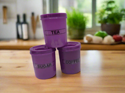 Three purple containers labeled 'Tea', 'Sugar', and 'Coffee' on a white background.
