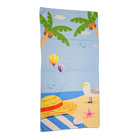 Beach towel with tropical design featuring palm trees, seagull, and hot air balloons on a blue background.