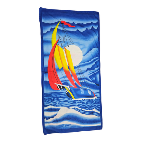 Towel with sailboat design on a blue background