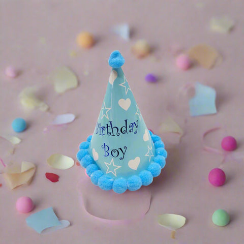 Blue birthday hat with 'Birthday Boy' text on a white background