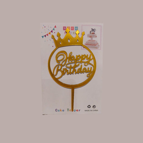 Gold 'Happy Birthday' cake topper with a crown on a white box packaging.