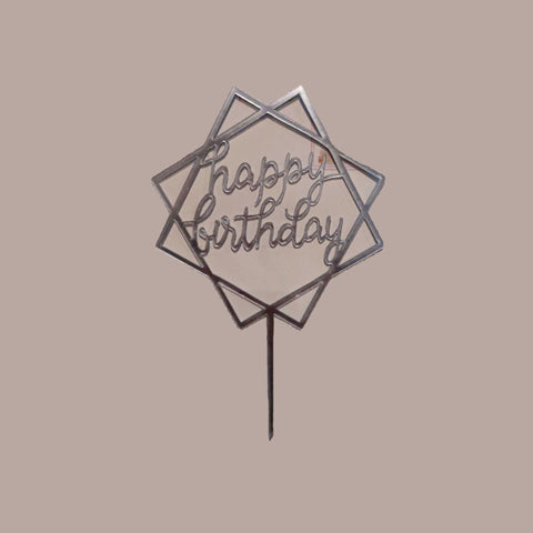 Hexagonal cake topper with 'Happy Birthday' text on a white background