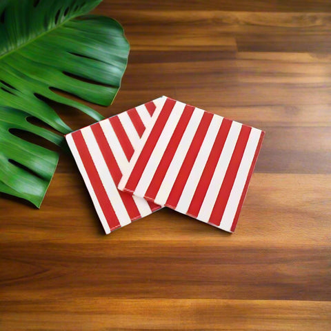 Two red and white striped napkins on a white background