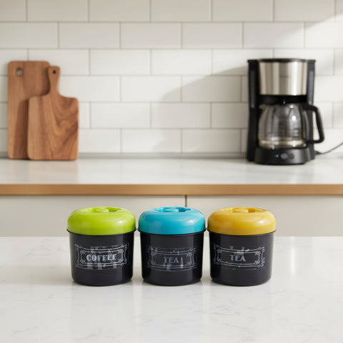 Three small containers with colorful lids on a white background